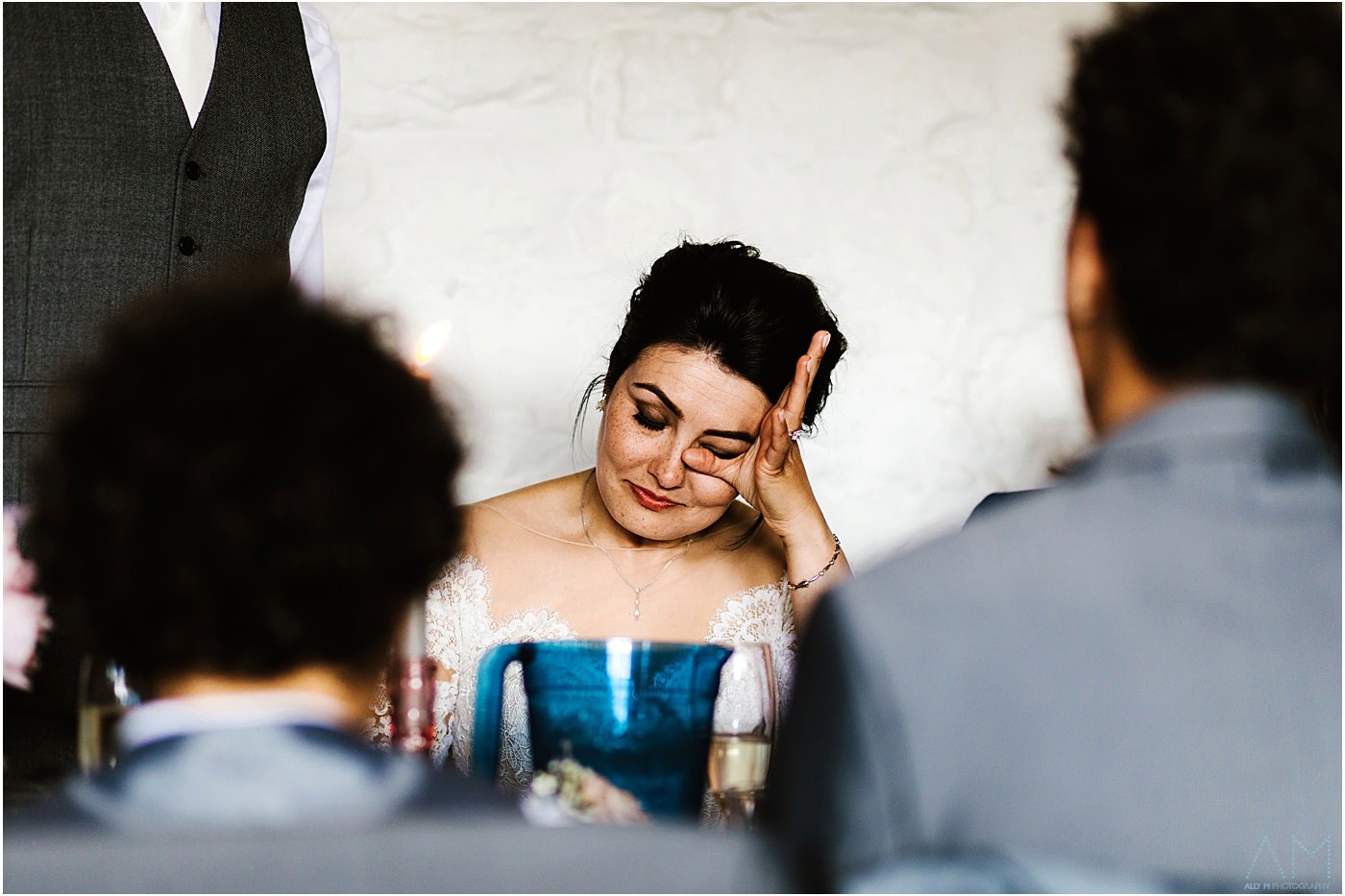 Emotional bride during speeches. Askham Hall Wedding photography