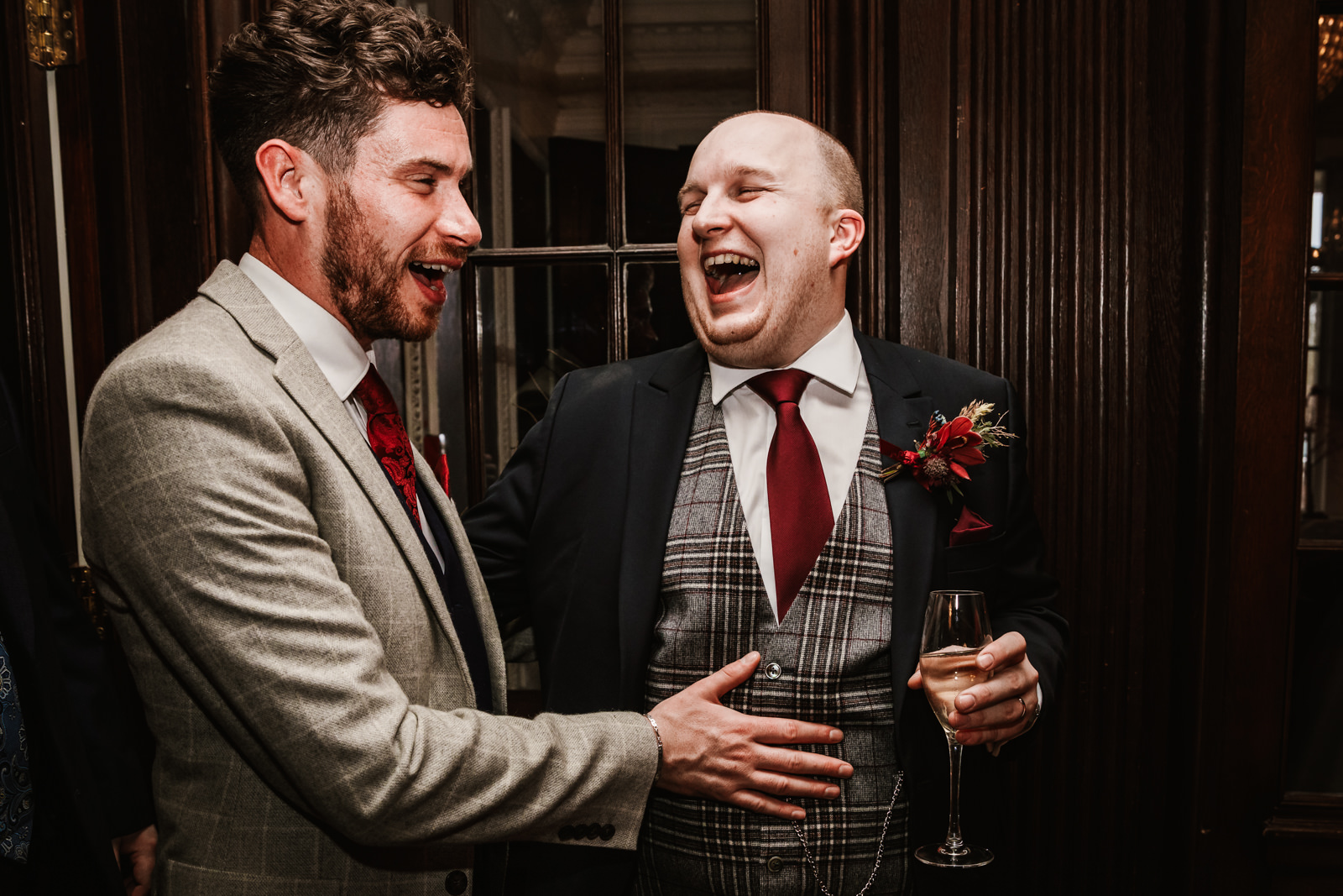 Groom laughing with his friend