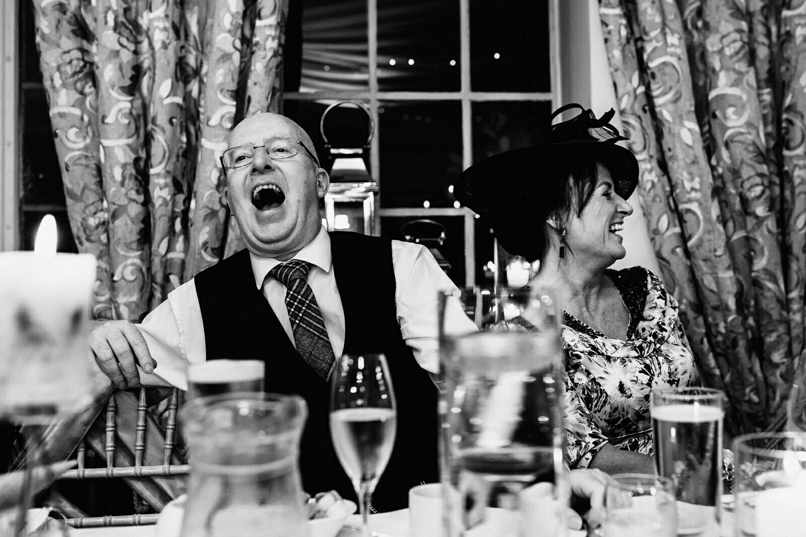 Father of the groom laughing