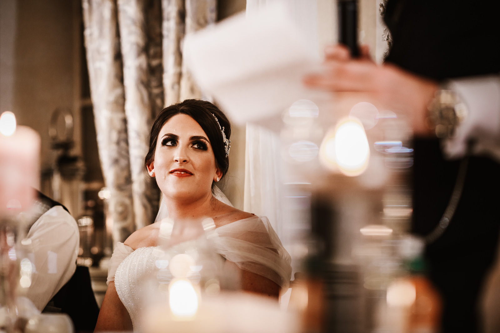 Bride smiling during her dads speech