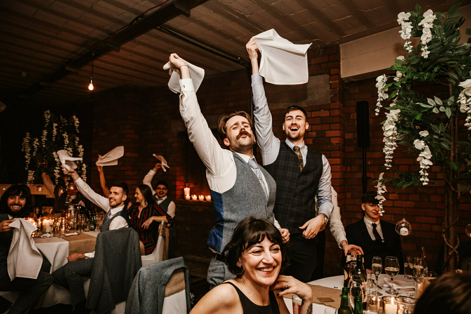 Wedding guests waving napkins