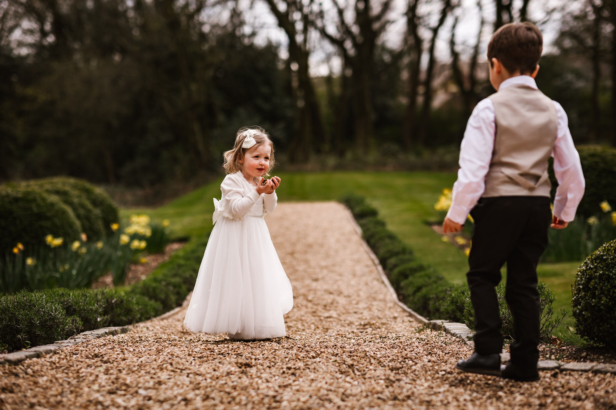 Flower girl playong with boy at Ashfield House