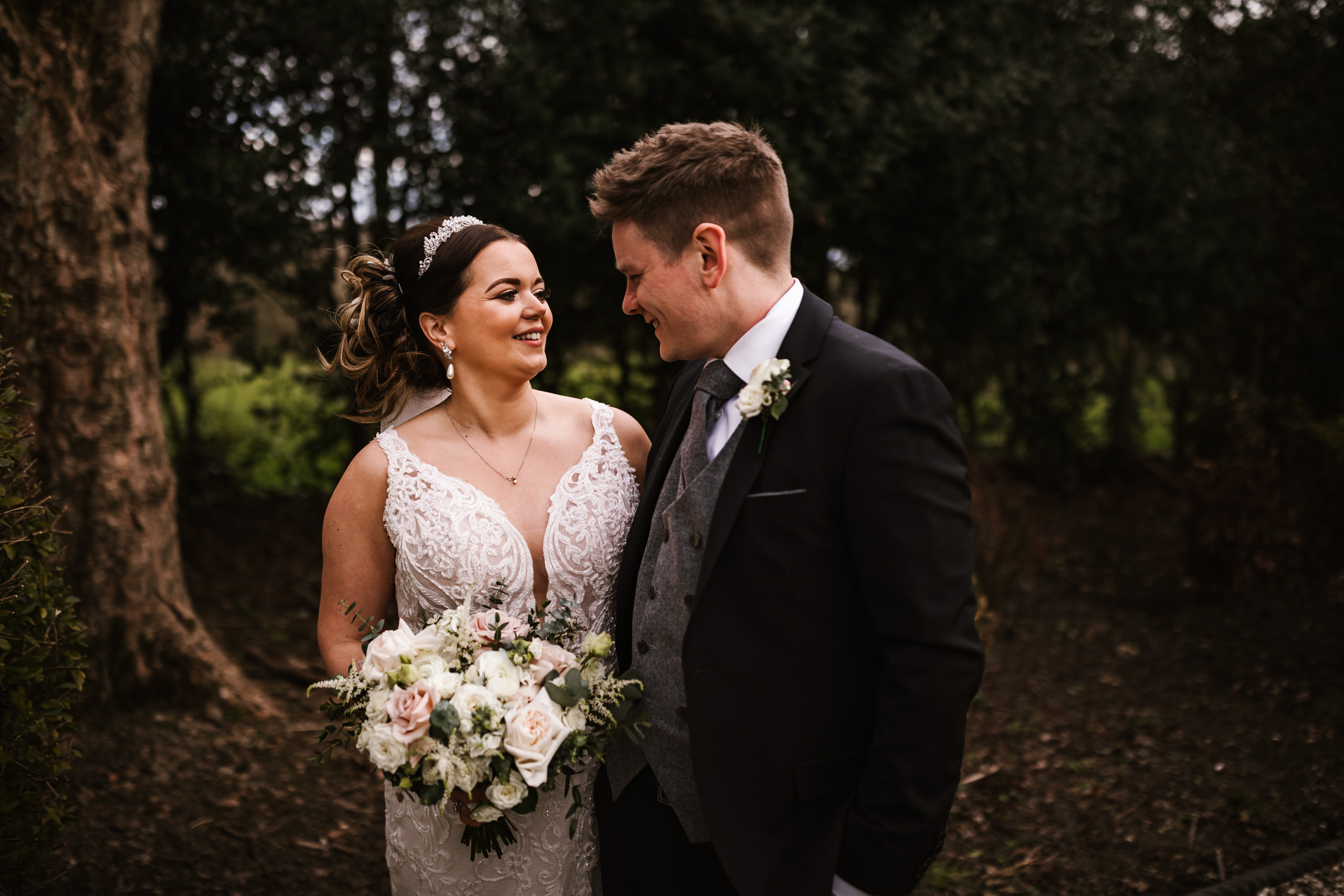 Bride smiling with her groom at Ashfield House