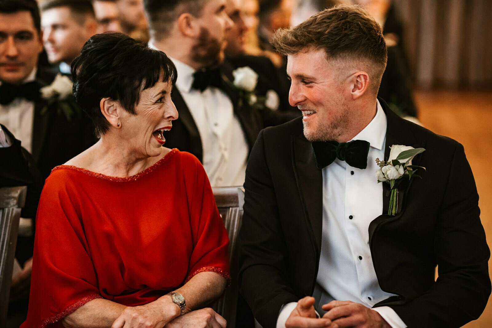 Mother of the groom and best man sharing a laugh at The Old Palace Chester